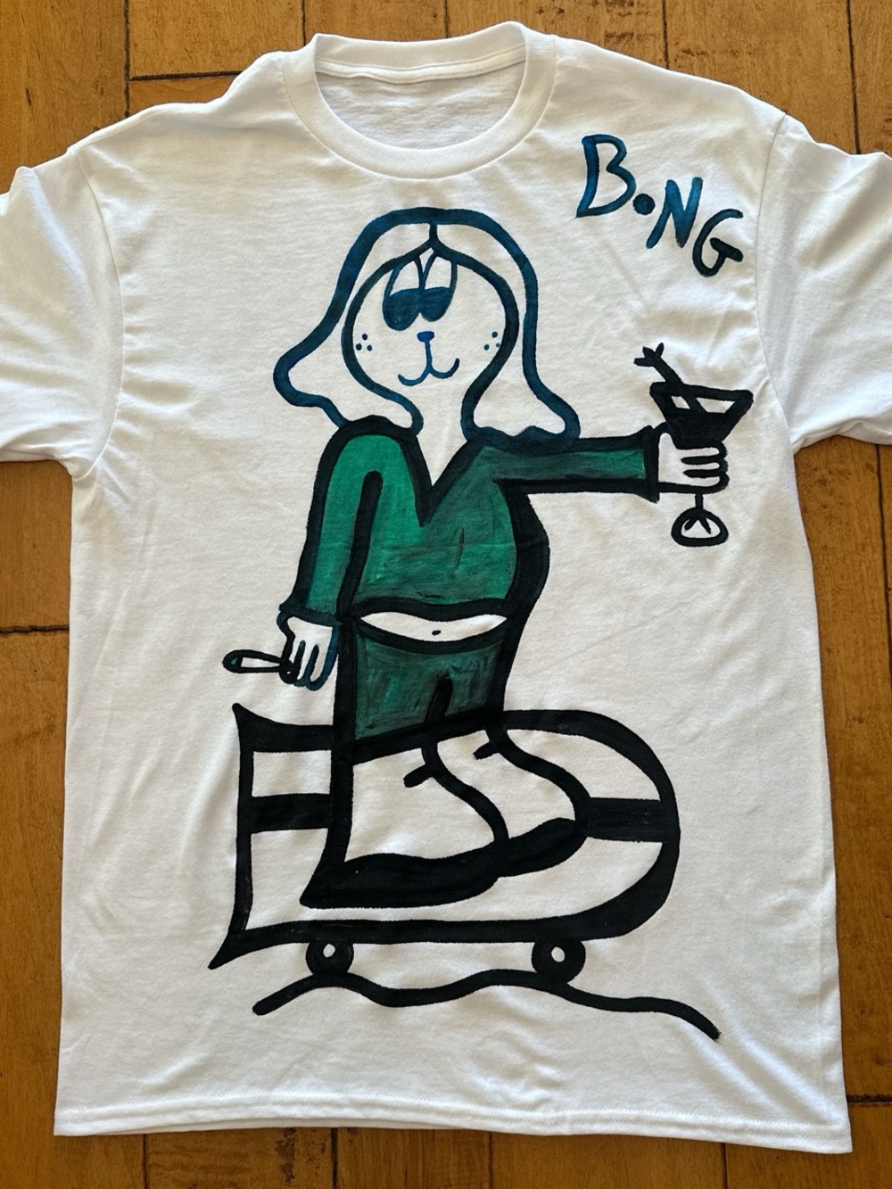 White T-Shirt with Green Cartoon Graphic Skateboard Surf